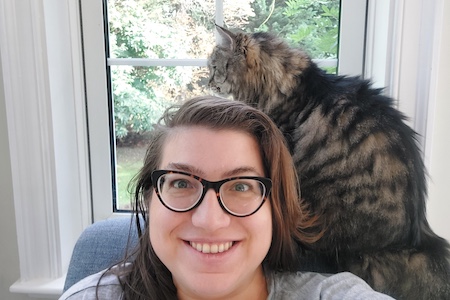 Lilly Reid with her cat Lilly Reid with a cat sitting by her